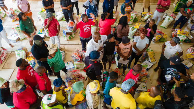 Aerial view of residents collecting food parcels at a MySol Foundation distribution