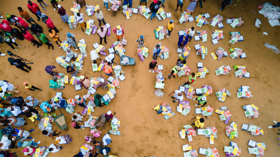 Aerial view of food parcels laid out for distribution at a MySol Foundation food drive.