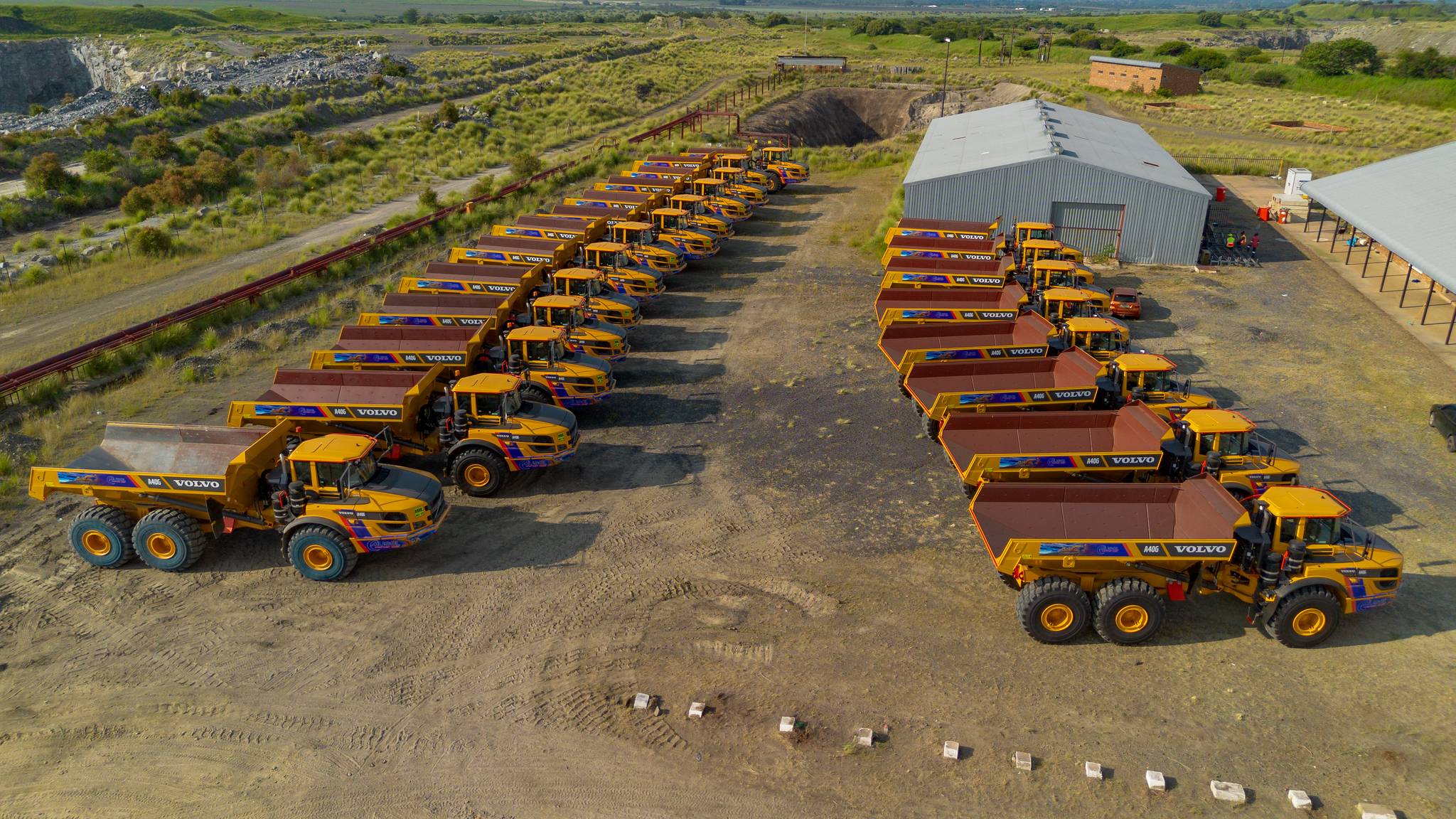 Heavy equipment fleet parked at MySol workshops.
